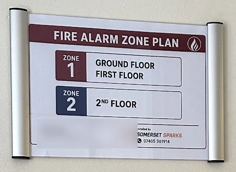 Fire alarm zone plan displayed beside a panel